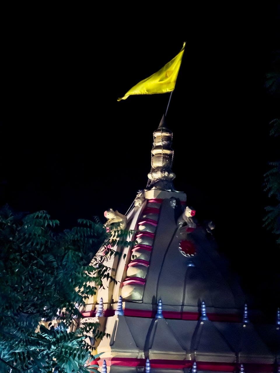 Temple spire lit at night